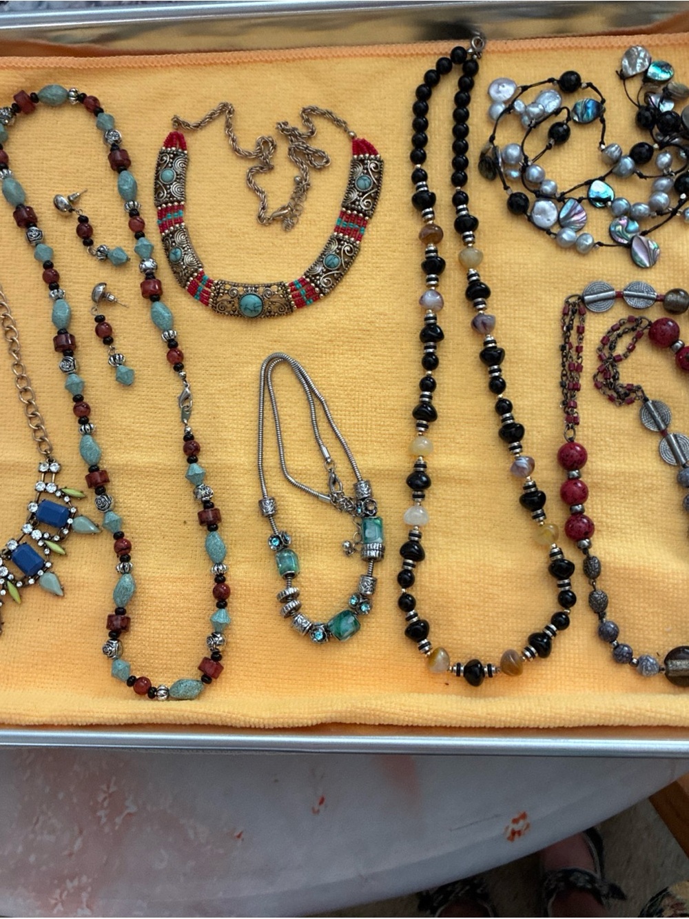 Lot of 7 Assorted Costume Necklaces. One Necklace With Earrings.
.